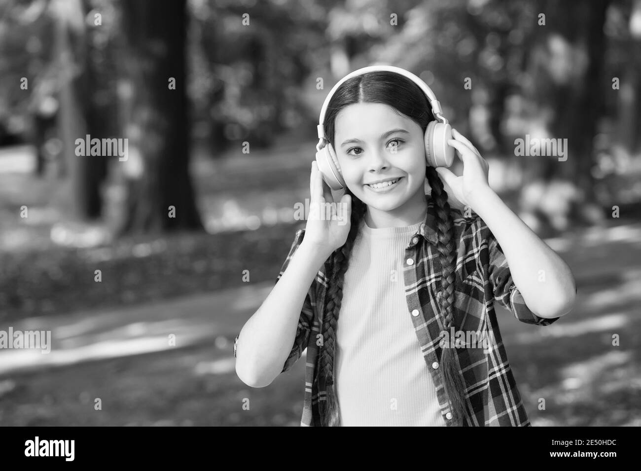 Fine engineering only for your ears. Happy kid wear ear phones natural