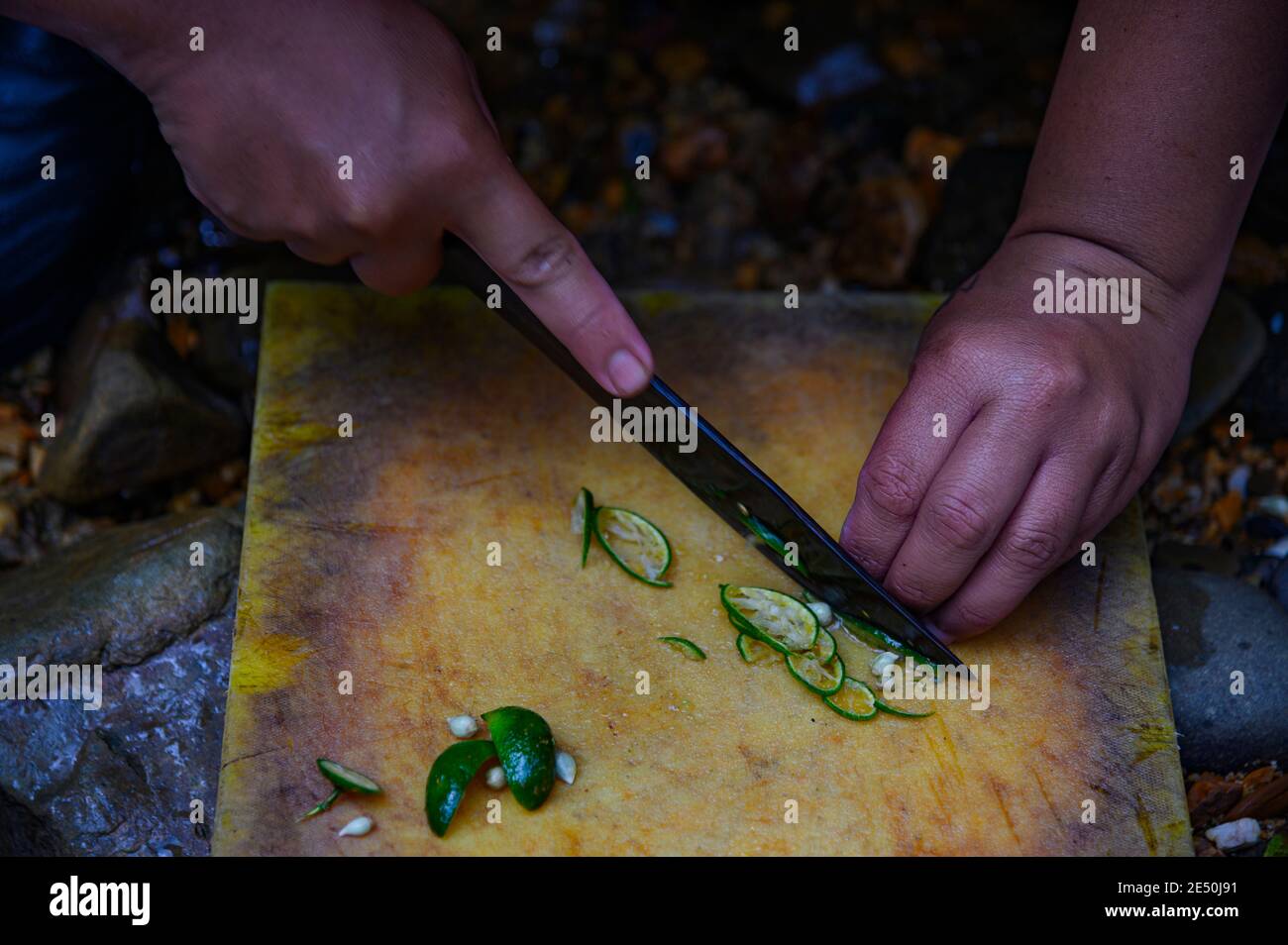 man slicing limes Stock Photo