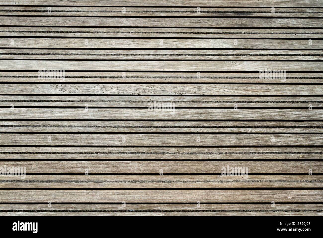 Wooden boards forming a walkway with grit lines to provide protection ...