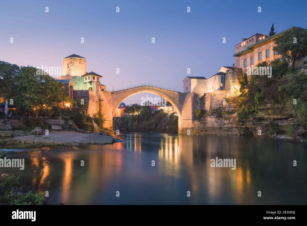 Evening, blue hour view of the iconic Stari Most bridge, Neretva River and old town of Mostar, Bosnia and Herzegovina. Stock Photo