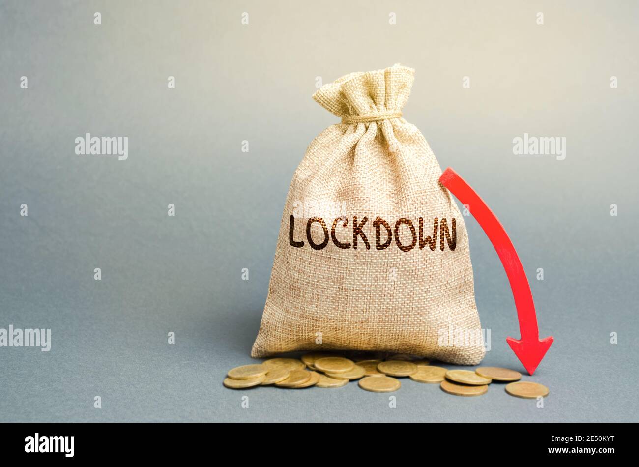 Money bag Lockdown and down arrow. Coronavirus pandemic infection. Financial and economic crisis concept. Global recession. Market crash, collapse. CO Stock Photo