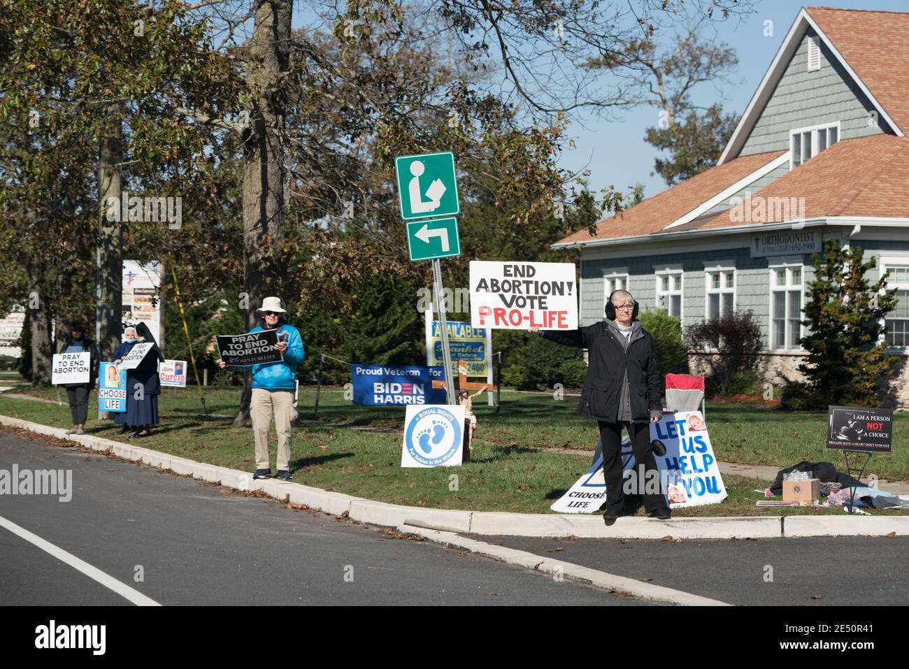 Galloway, NJ - Oct. 31, 2020: Woman holding an 'End Abortion! Vote Pro-Life' sign is part of an anti-abortion protest group. Stock Photo