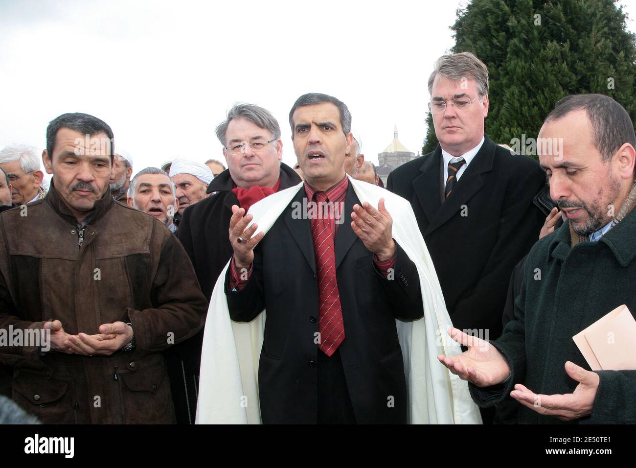 Abdelkader Aoussed, a representative of Paris mosque, lays a wreath of flowers at a defaced grave of Muslim World War I soldiers next to France's administration mediator ,Jean-Paul Delevoye during a ceremony at the cemetery of Ablain-Saint-Nazaire, northern France, on April 7, 2008. Vandals inscribed Sunday night graves in the cemetery with anti-Islam slogans and also left graffiti singling out Justice Minister Rachida Dati, who is of North African origin. 148 tombs were targeted. Photo by Eric Pollet/ABACAPRESS.COM Stock Photo