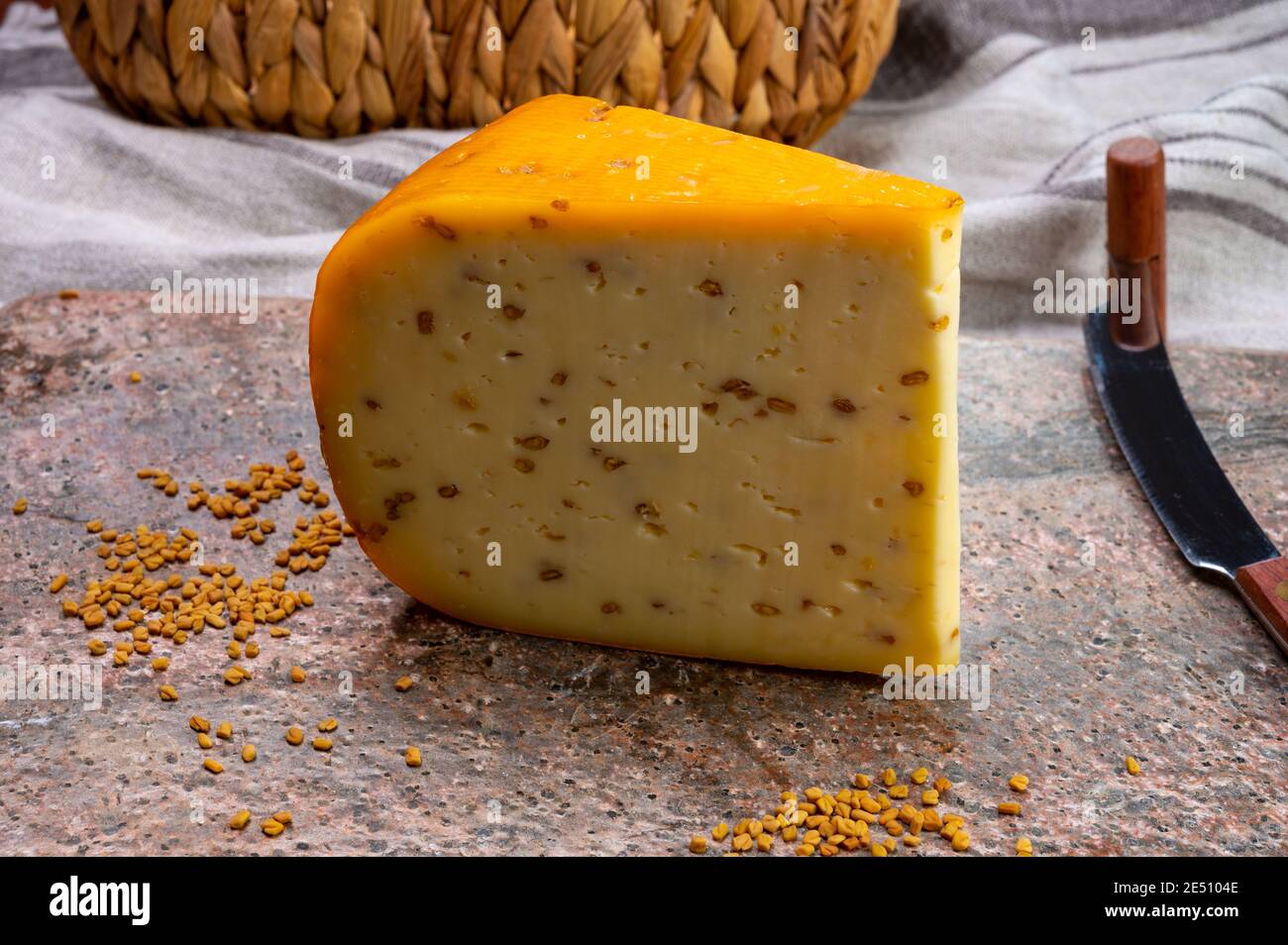 Cheese collection, piece of hard yellow Dutch gouda cheese with dried
