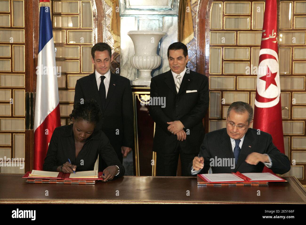 French Foreign affairs and Human Rights Junior Minister Rama Yade and  Tunisian Foreign Minister Abdelwahab Abdallah sign documents as French  President Nicolas Sarkozy (L) and Tunisian President Zine El Abidine Ben Ali