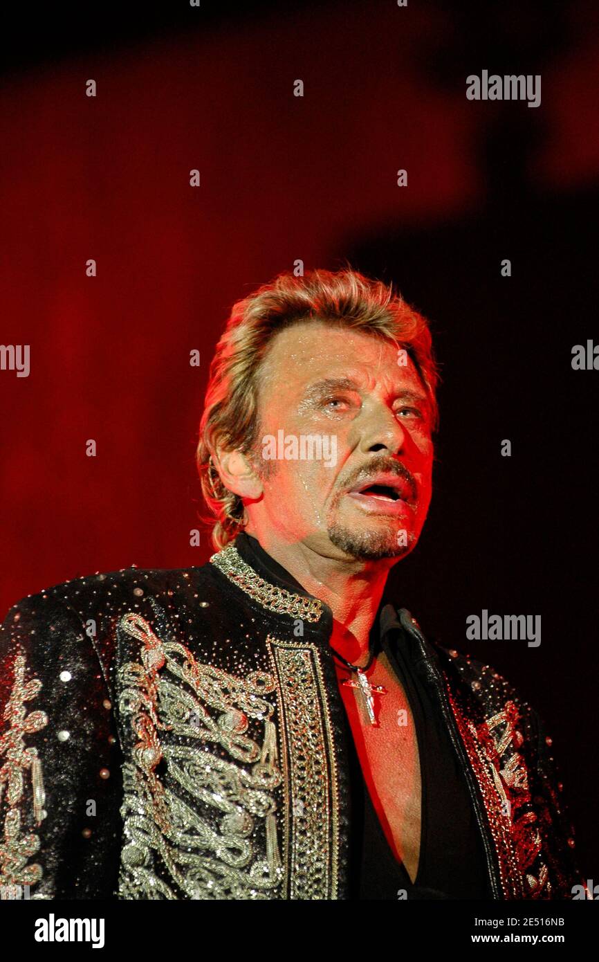 French singer Johnny Hallyday performs live on stage during 'Les Vieilles Charrues' festival, in