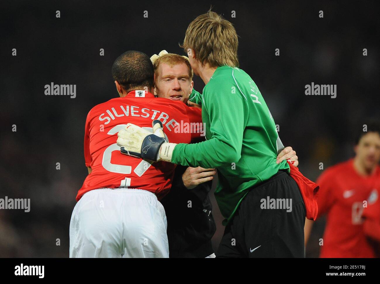 Manchester United's Mikael Silvestre celebrates with Paul Scholes and Tomasz Kuszcak at the end of the UEFA Champions League Semi-Final second leg soccer match between Manchester United and FC Barcelona at Old Trafford in Manchester, England on April 29 2008. Manchester won 1-0. Photo by Steeve McMay/Cameleon/ABACAPRESS.COM Stock Photo