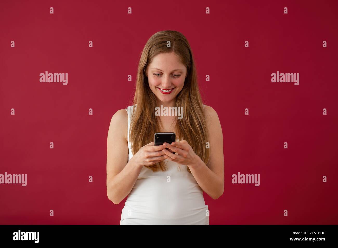 Happy white blonde woman typing hi-res stock photography and images - Alamy