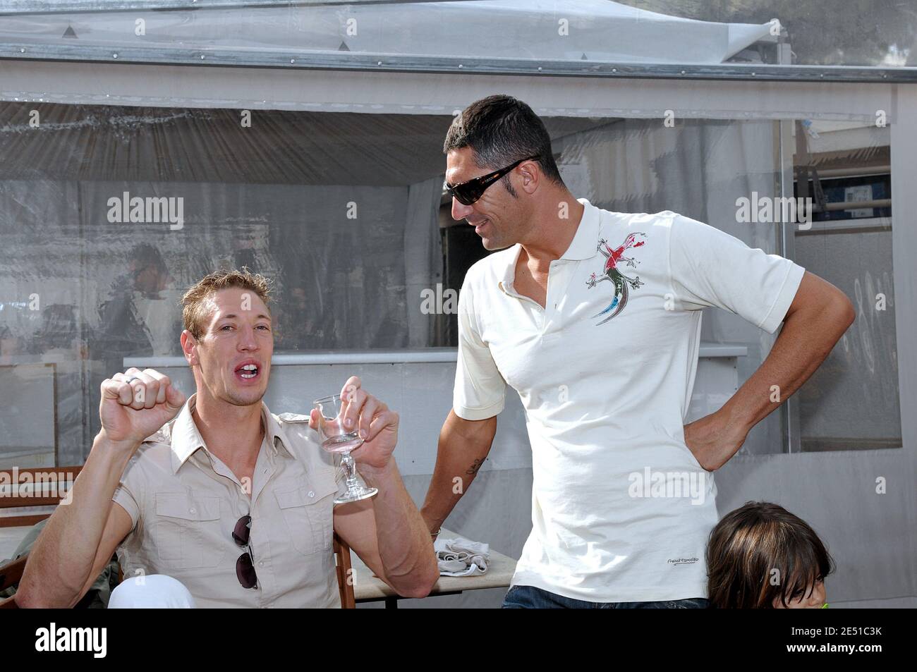France's Alain Bernard speaks with coach and former swimmer Franck Esposito who presents his new collection on the beach Miramar on 'La Croisette' in Cannes, France on May 12, 2008. Photo by Capbern/Cameleon/ABACAPRESS.COM Stock Photo