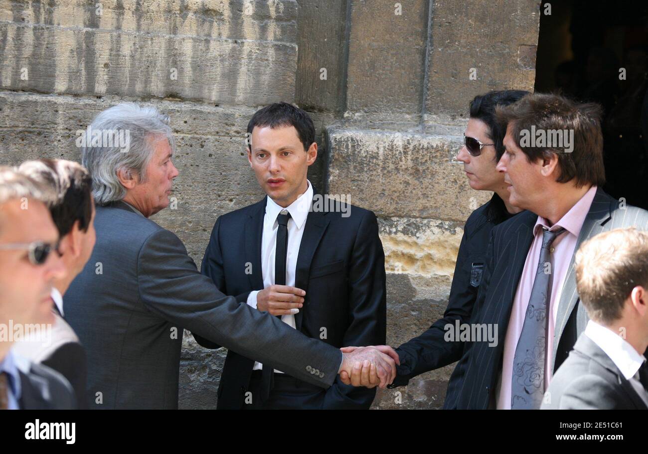 Alain Delon, Marc-Olivier Fogiel and Jean-Luc Lahaye leave the service to  pay homage to TV presenter Pascal Sevran at St Louis en l'Ile church in  Paris, France on May 13, 2008. Sevran