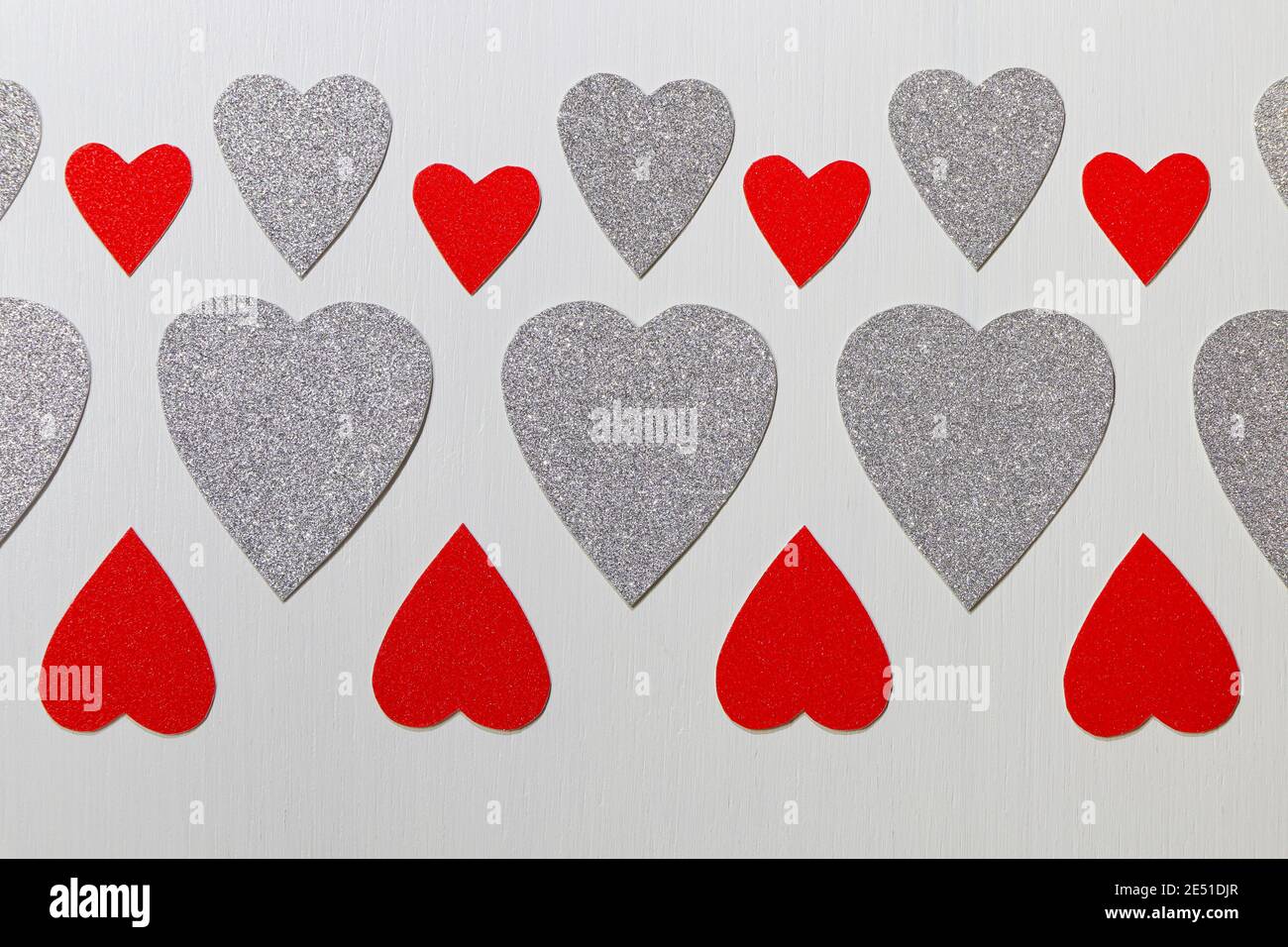 Red And Silver Hearts Pattern On Textured White Stock Photo - Alamy