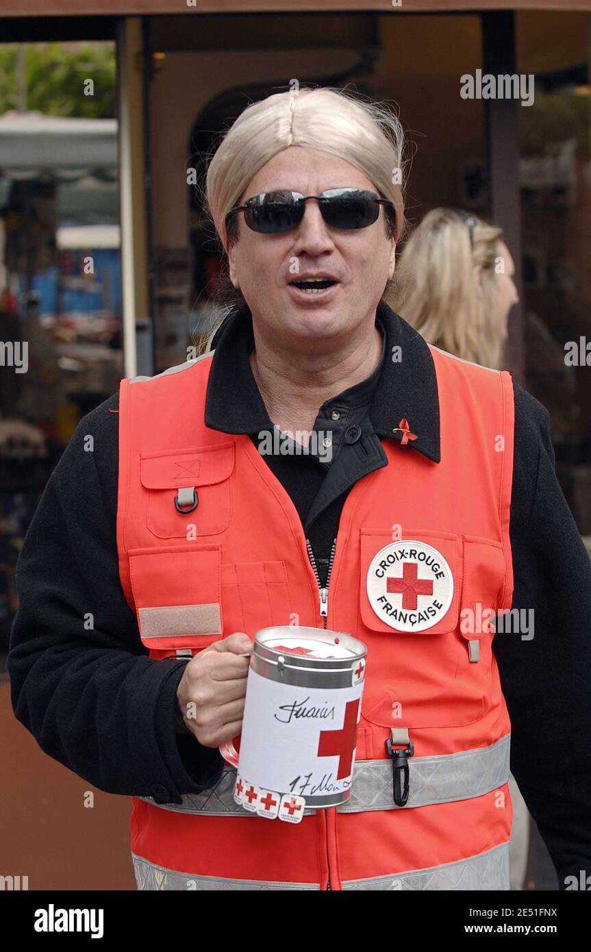 Francis Lalanne helps to collect funds to benefit the French Red Cross  during a national collect