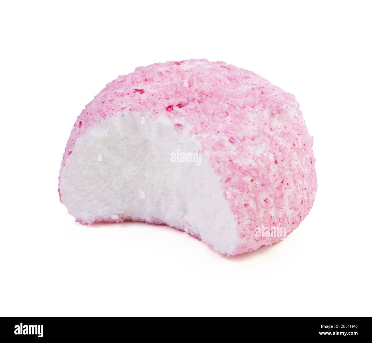 Crunchy pink coconut ball candy on white background Stock Photo - Alamy