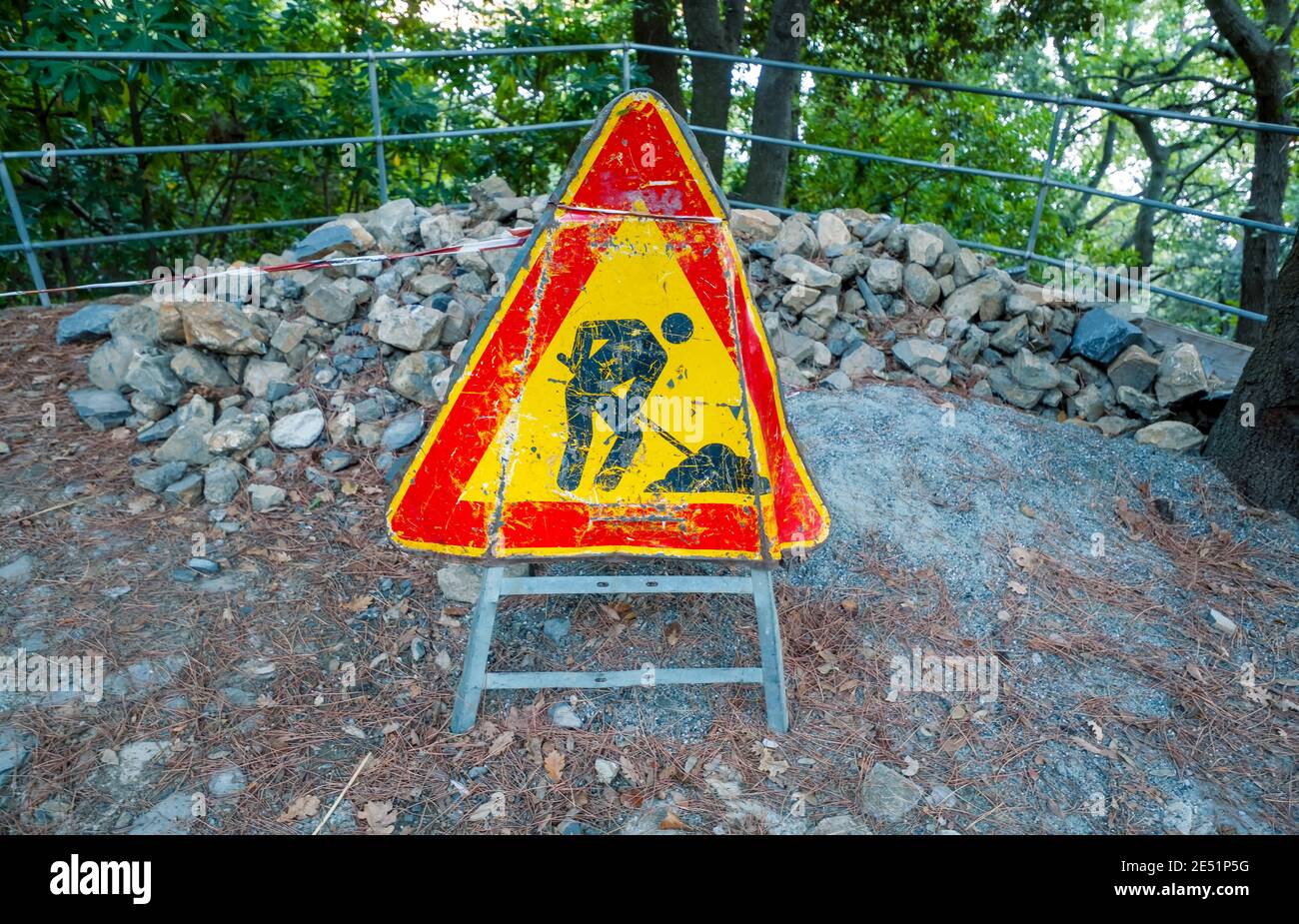 Road construction site sign with stones in Portofino, italy Stock Photo