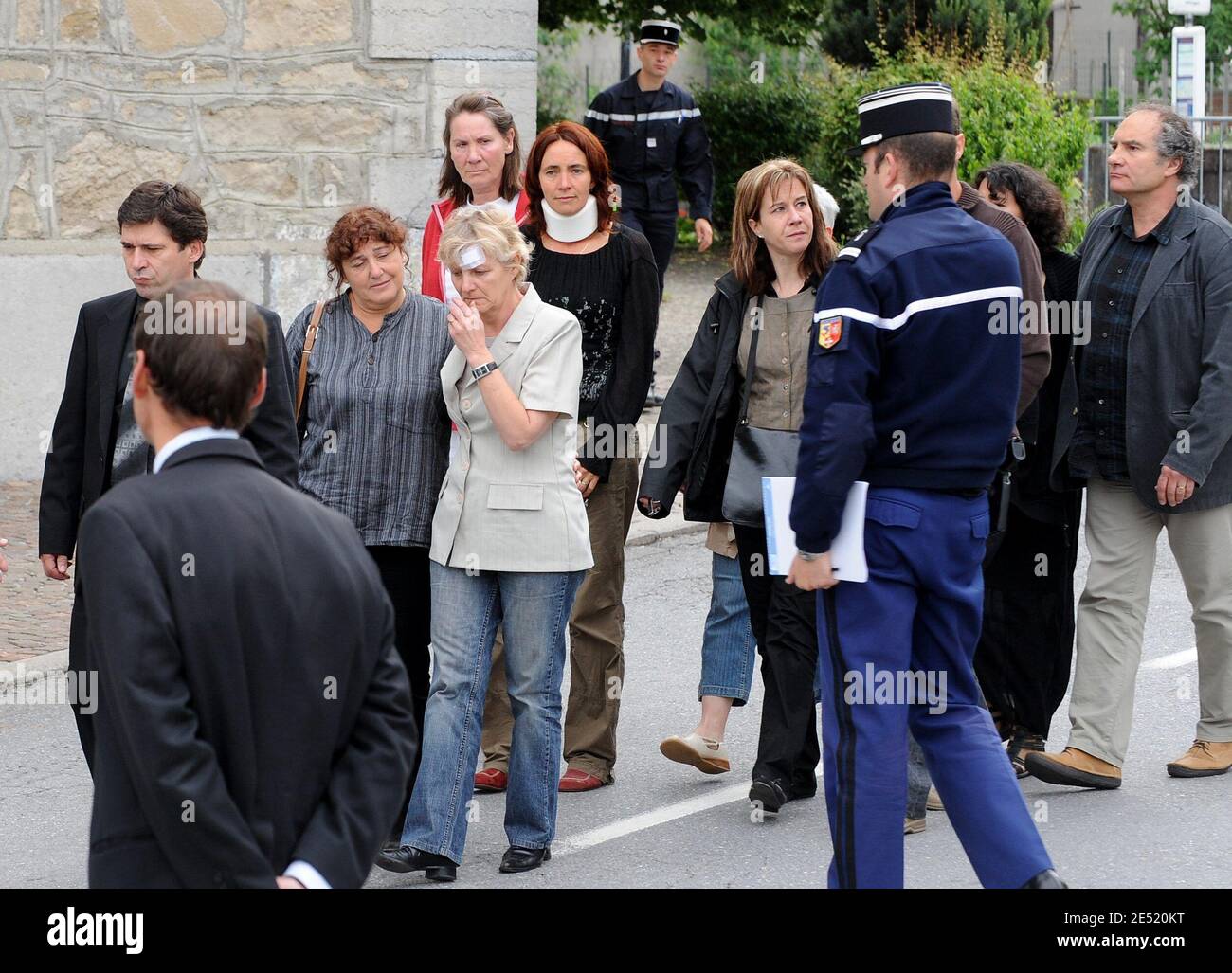 Marie-Therese Favre (C) and Beatrice Francois (R), two injured teachers of  the Margencel school, French Alps, leave the funeral chapel in Allinges,  French Alps, on June 3, 2008, a day after their