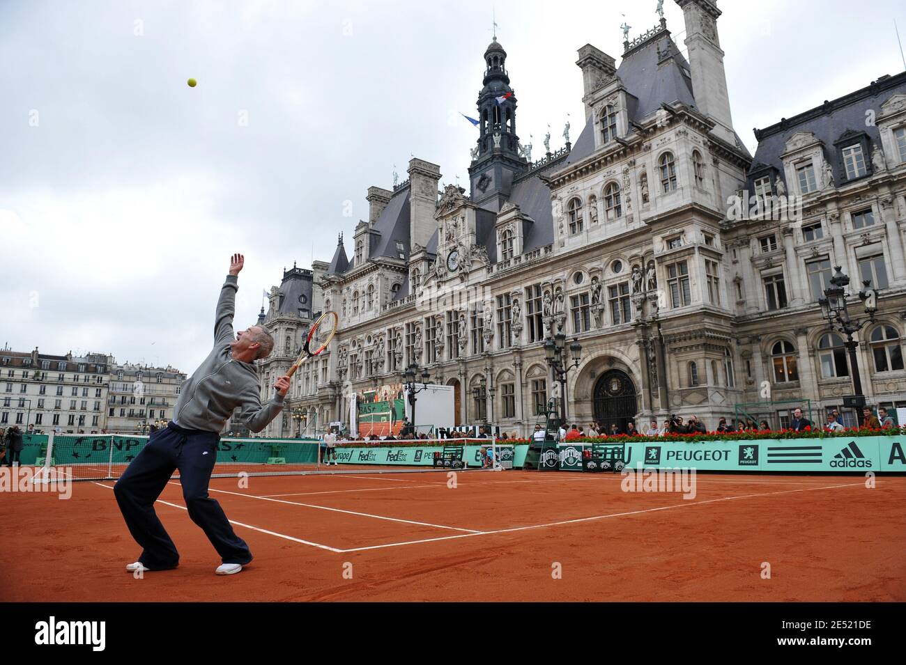 USA's former tennis player John McEnroe plays during the exibition  organised by the French tennis federation and the 'Mairie de Paris', on  Paris city hall Square at the Hotel de Ville in