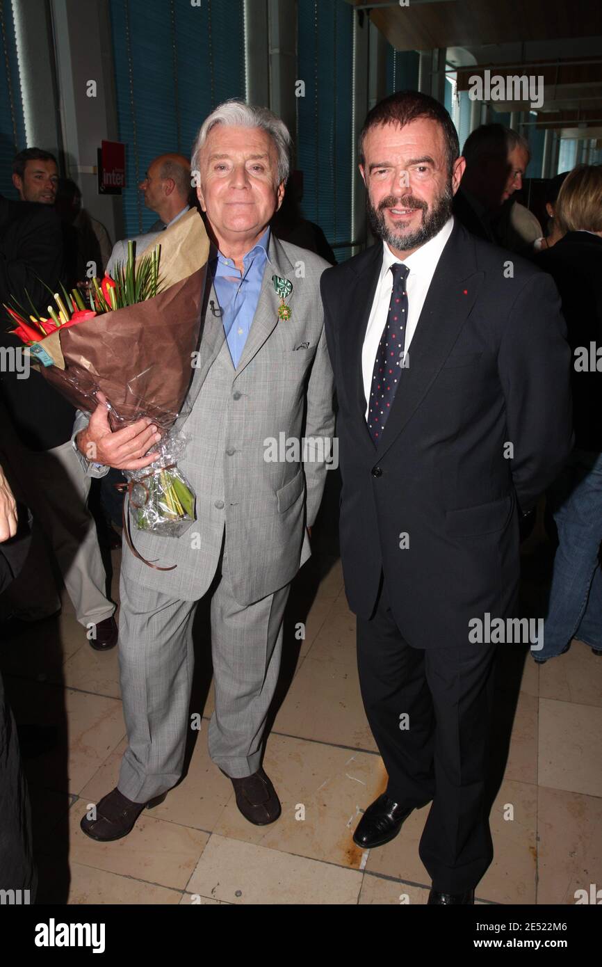 Louis Bozon (L) poses with Jean-Paul Cluzel, during the 50th birthday of  the radio show 'Le jeu des 1000 euros' after being awarded Commandeur of  the Order of Arts et Lettres, a