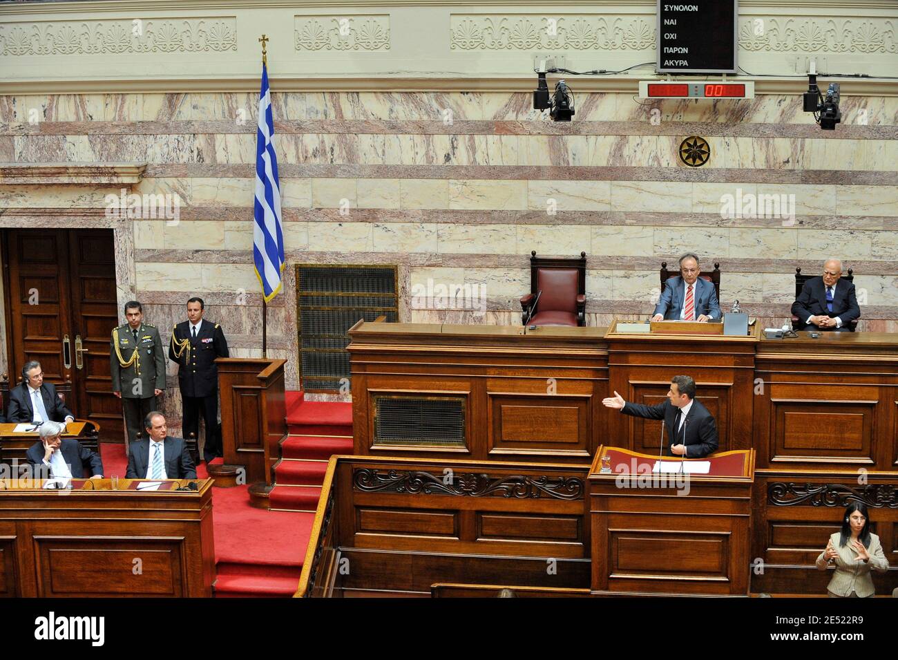 Greek President Karolos Papoulias (Back-R) and speaker of the Greek parliament Dimitri Sioufas (C-back) watch French President Nicolas Sarkozy addressing the parliament in Athens, Greece on June 6, 2008. Sarkozy arrived in Greece Friday for an official visit, the first by a French head of state in more than 25 years. Sarkozy was addressing the Greek parliament in a ceremony only accorded to three foreign presidents in the past: his predecessor Charles de Gaulle and US presidents Dwight Eisenhower and George Bush Sr. Photo by Mousse/ABACAPRESS.COM Stock Photo