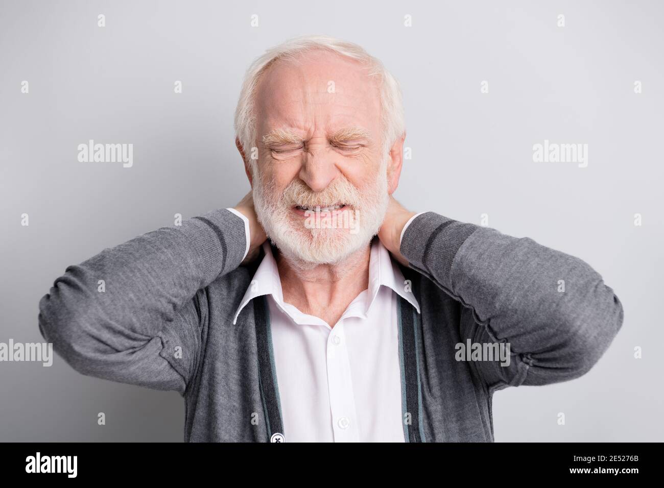 Portrait of old white hair sad man hands neck pain wear dark sweater isolated on grey background Stock Photo - Alamy Portrait of old white hair sad man hands neck pain wear dark sweater isolated on grey background Stock Photo - Alamy
