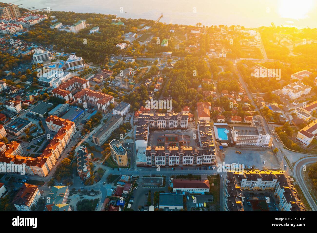 Aerial view of architecture European town sea coastline in sunset. Stock Photo