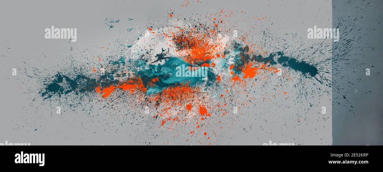 big colorful abstract orange, turquoise, white color spot on two tone gray background, multicolor paint splash in studio, leave an exciting pattern of Stock Photo