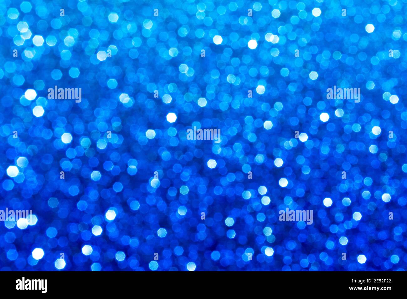 Abstract blue glitter lights background. Circle blurred bokeh. Festive ...