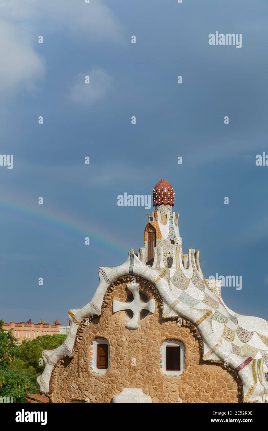 Rainbow appearing over the Gingerbread House (Gatehouse) in Park Guell