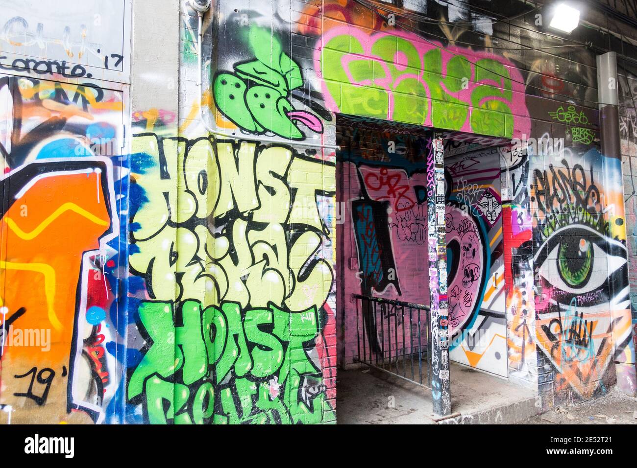 A large number of colourful wall paintings that have become a minor tourist attraction in an area known as Graffiti Alley in Toronto Ontario Canada Stock Photo