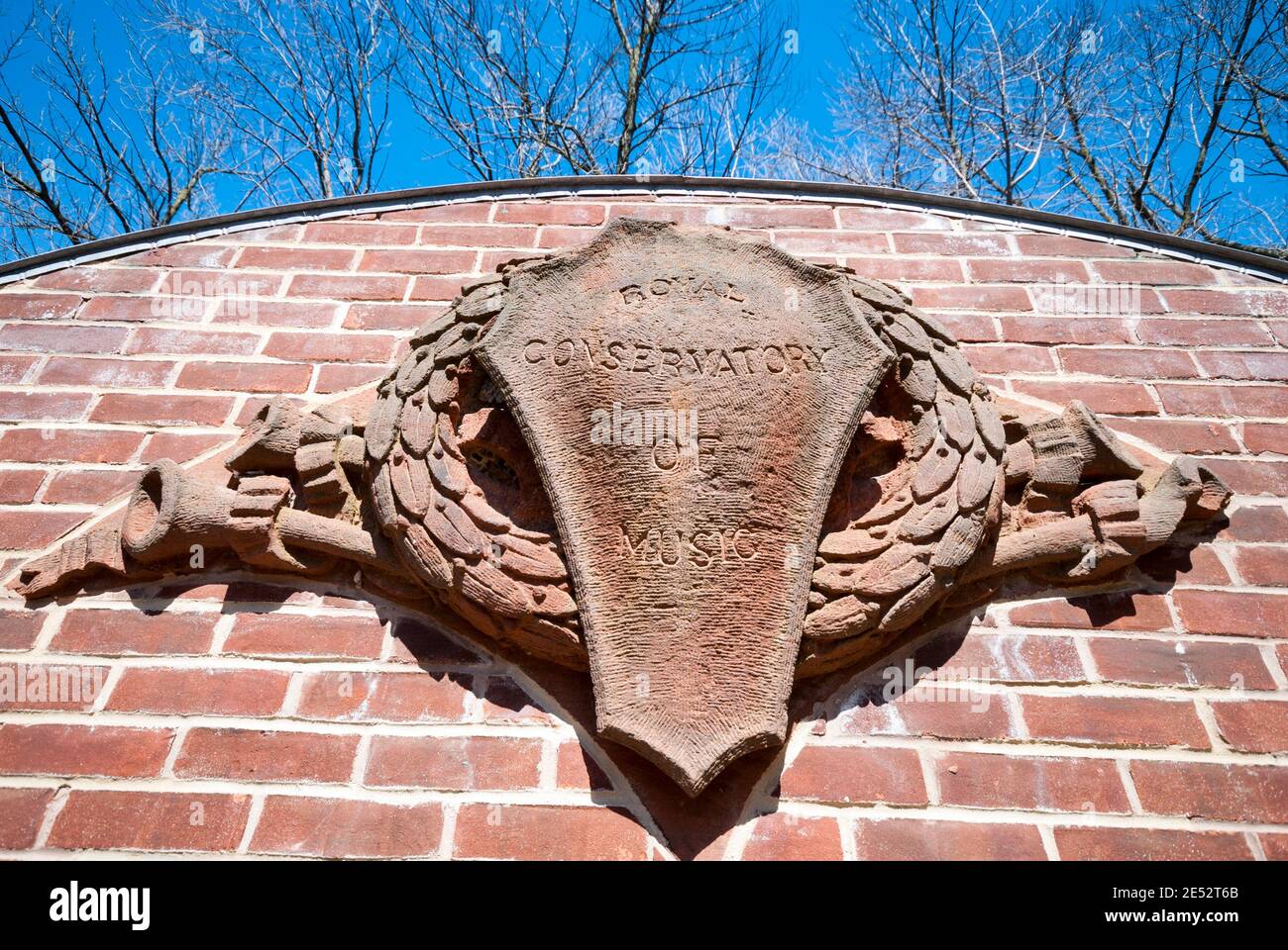 A stone facade with the inscription the Royal Conservatory of Music rescued from a demolished Toronto building. Stock Photo