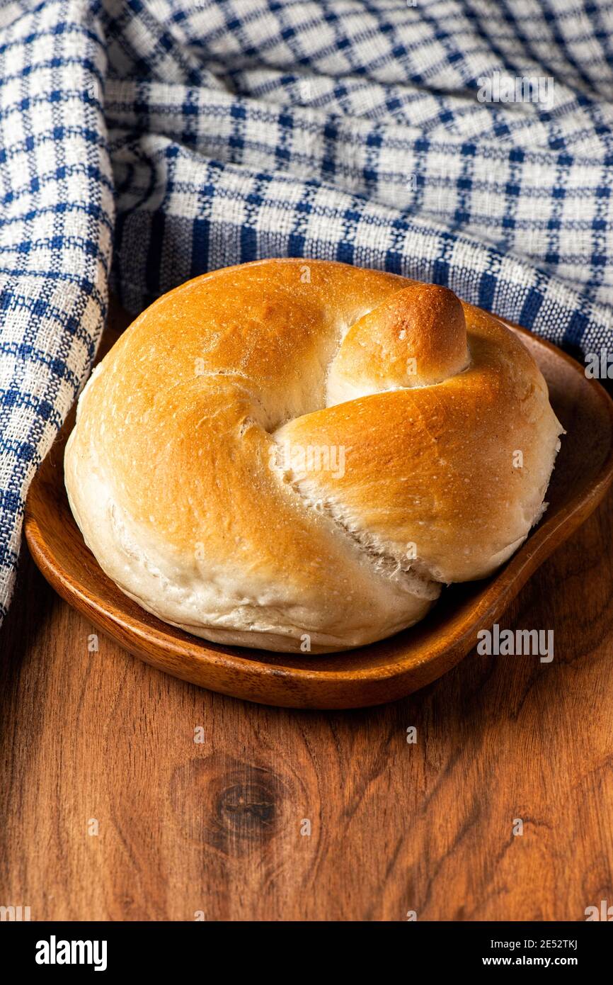 Delicious fresh baked knot bread roll Stock Photo Alamy