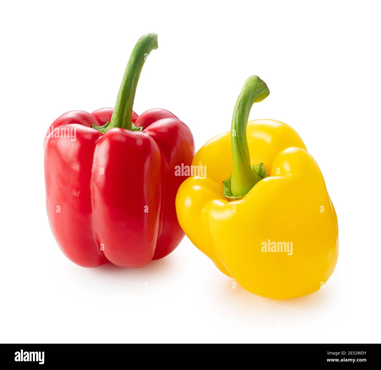Red and yellow bell peppers on a white background Stock Photo - Alamy