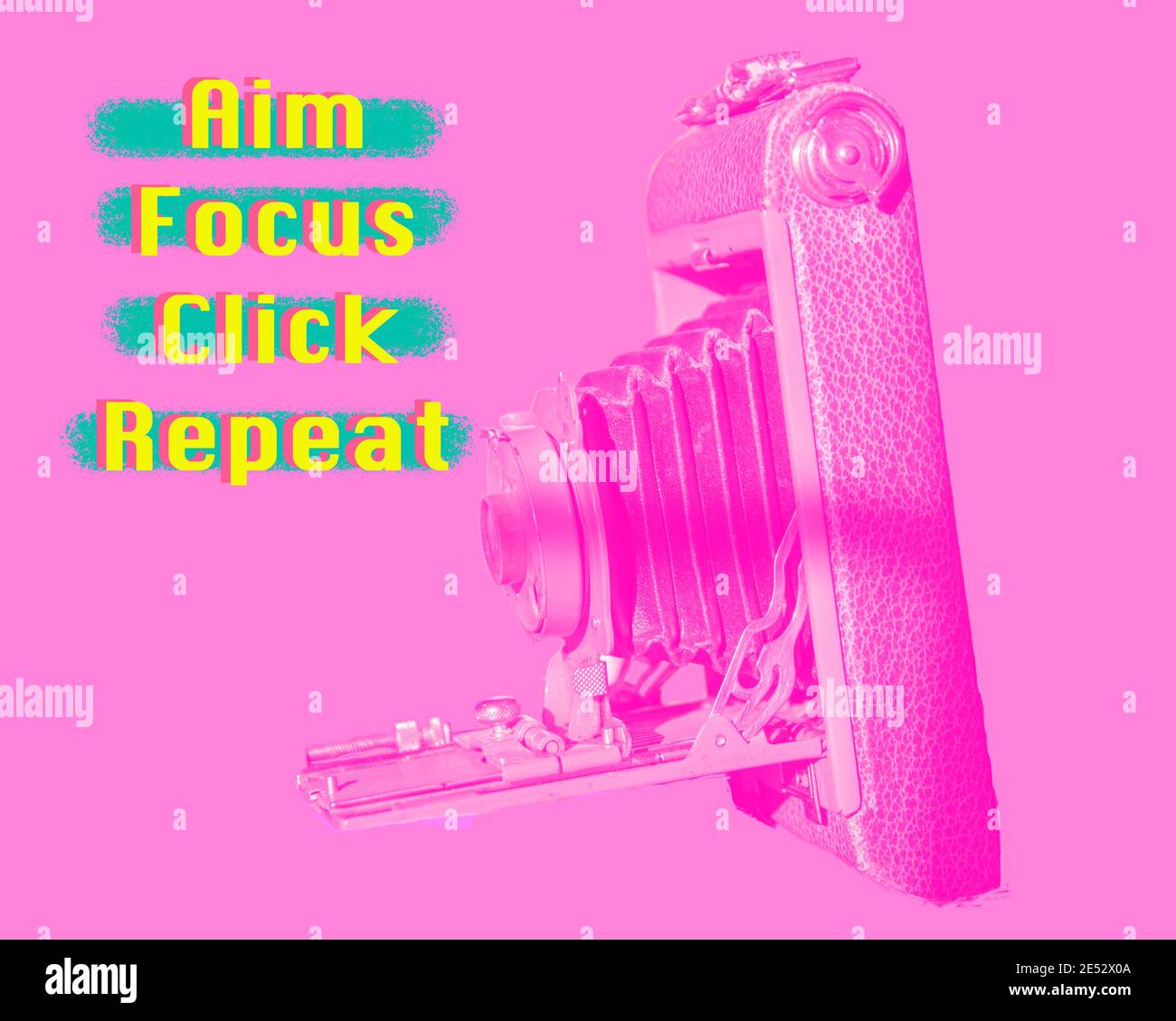 Analog Camera photo with a hot pink filter, and neon text: Aim, Focus,  Click, Repeat Stock Photo - Alamy