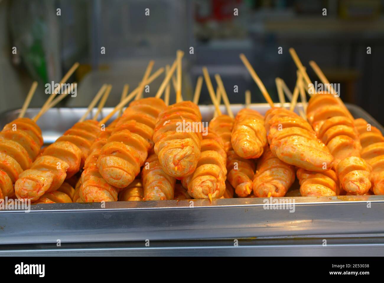 Street food market in Jiaxing, Zhejiang, China. Hotdogs cut and sprinkled with spices. Jan 2020 Stock Photo