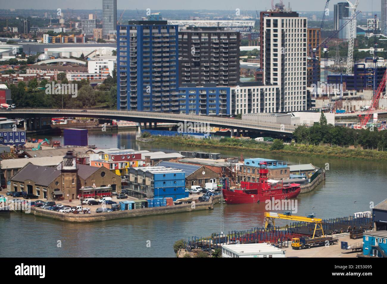 An aerial view of Trinity Buoy Wharf, the Lower Lea Crossing and apartment buildings on Bow Creek of the River Lea and the River Thames in London, UK. Stock Photo