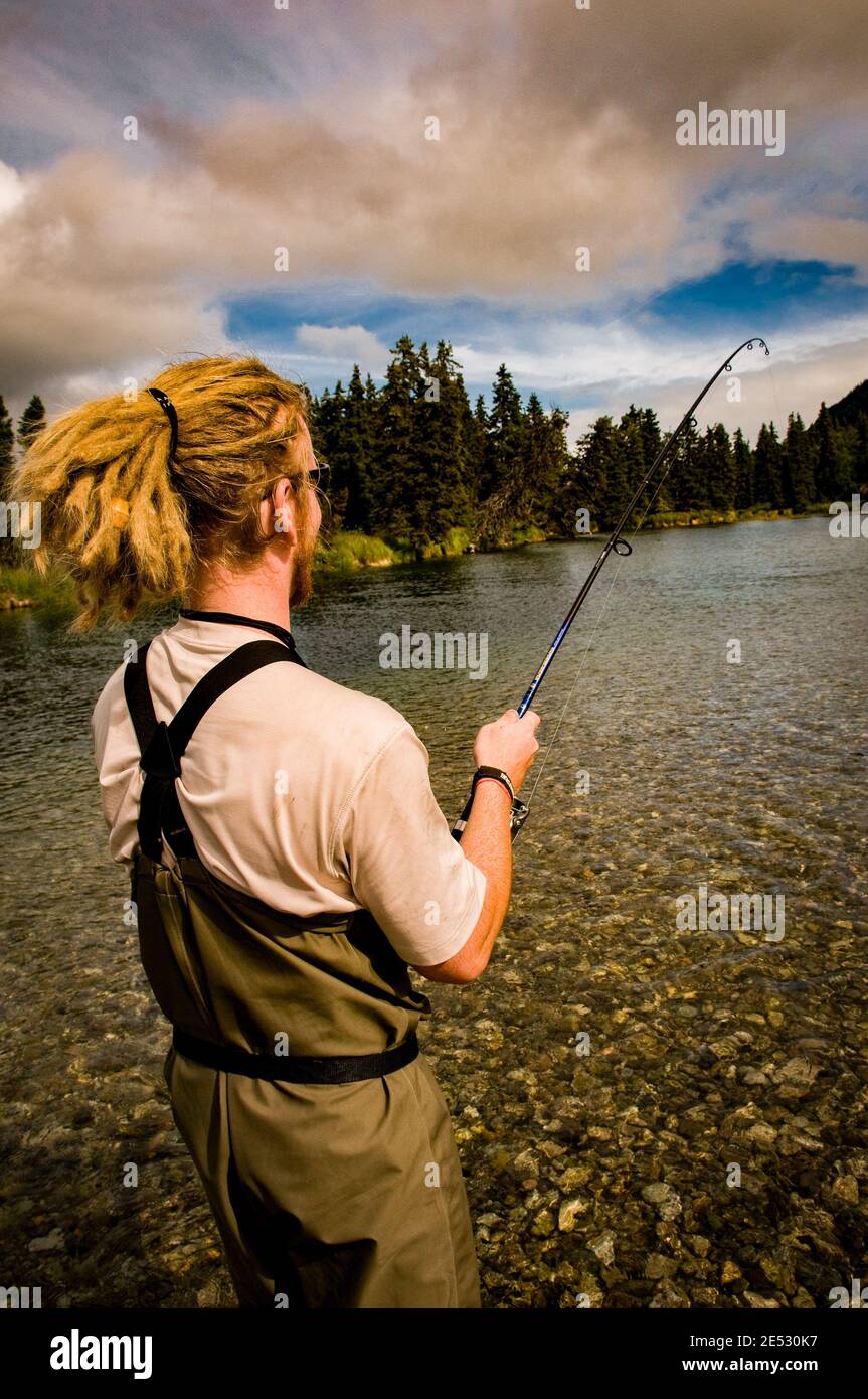 Fishing for Lake Trout and Salmon in the Kijik River in Southwest Alaska. MR Available. Stock Photo