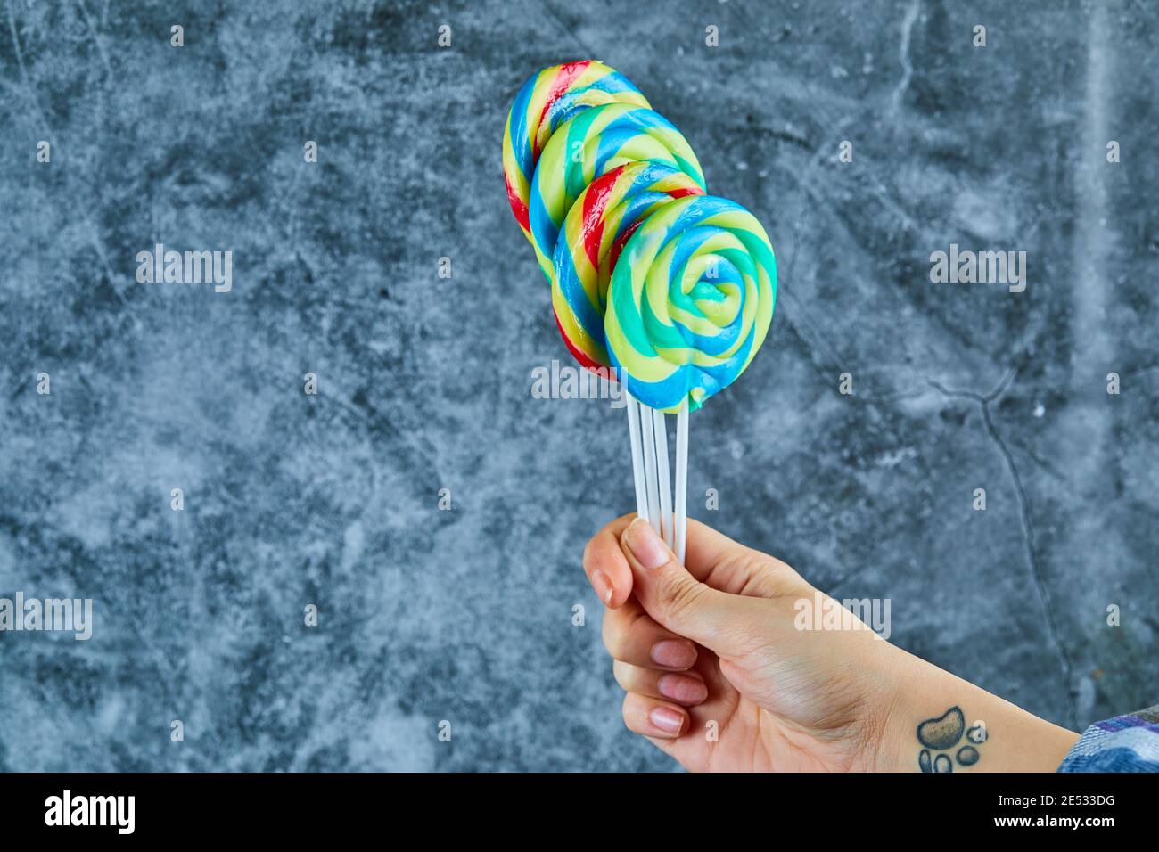 Colorful lollipops on marble background Stock Photo