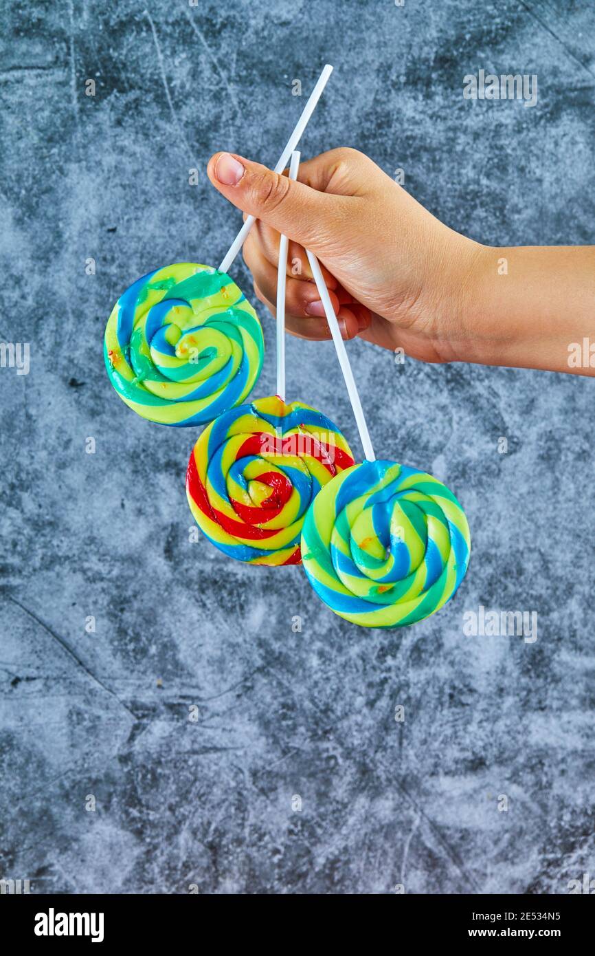 Colorful lollipops on marble background Stock Photo