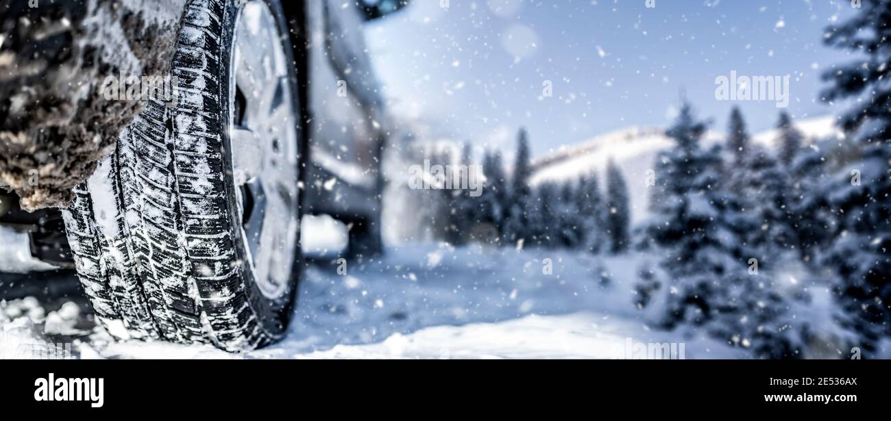 Winter tire. Detail of car tires in winter on the road covered with