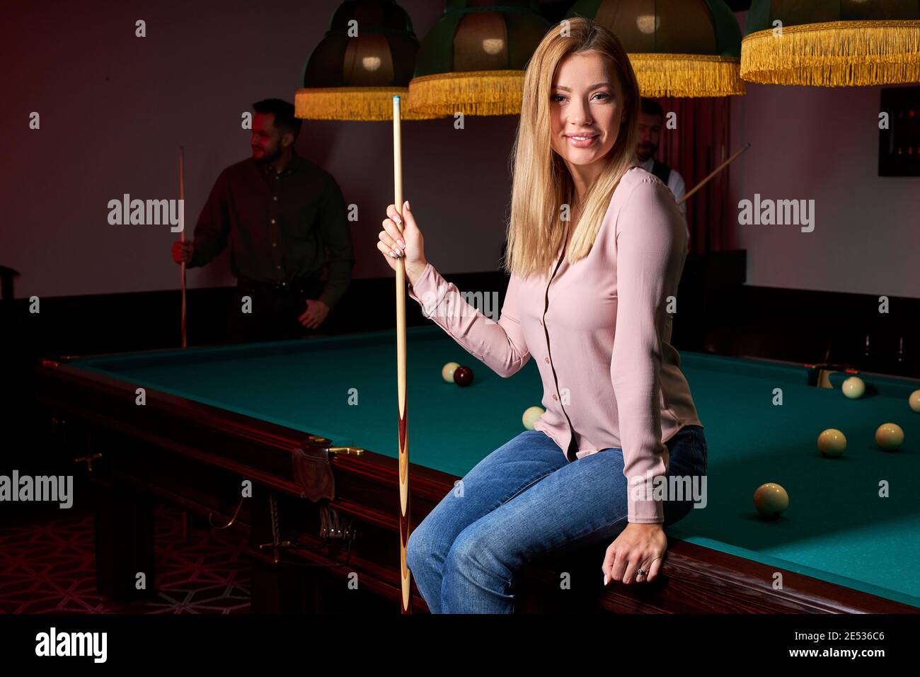 Premium Photo  Beautiful young girl came on a weekend to play billiards  for curiosity concept of a girl playing billiards