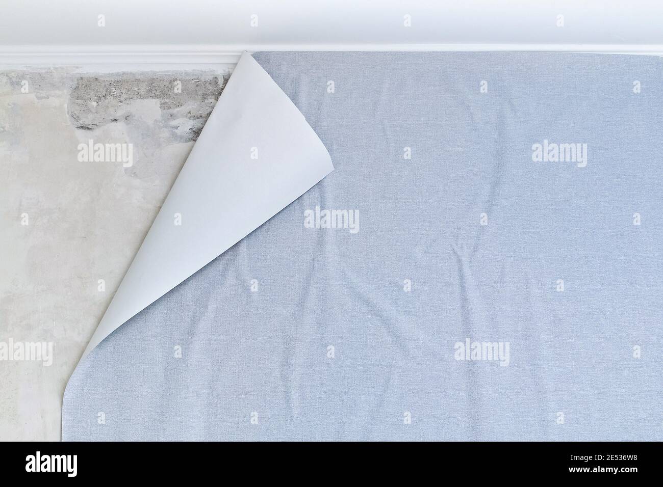 Glued paper textured gray wallpaper on a non-woven base. Creative abstract background. Stock Photo