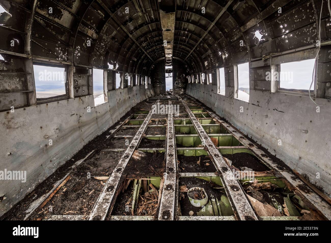 nterior of the fuselage of the wreck of an old, abandoned plane Stock Photo