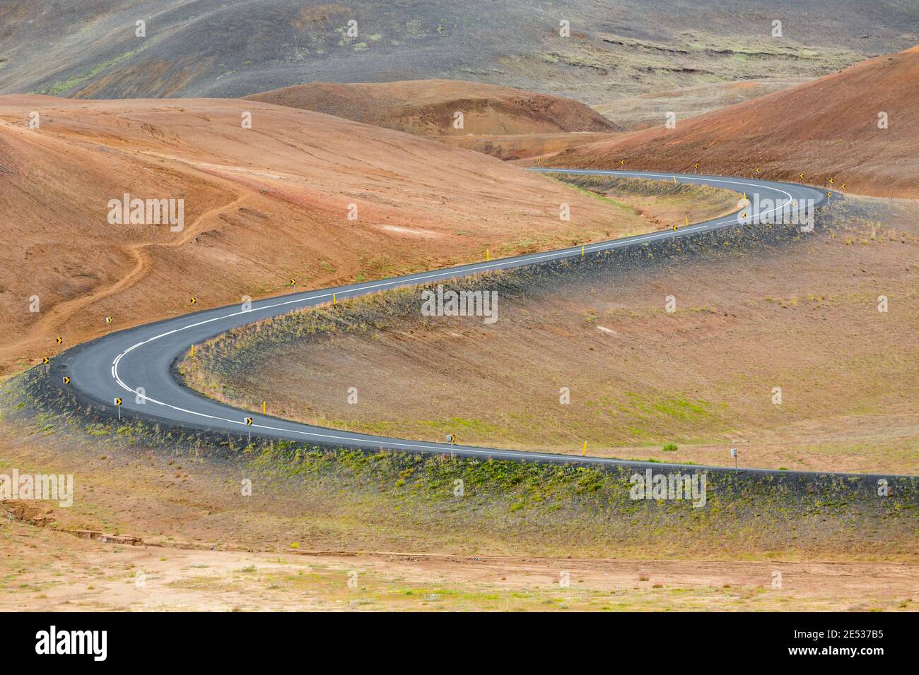 Close up of the iconic icelandic Route 1 snaking through the red ...