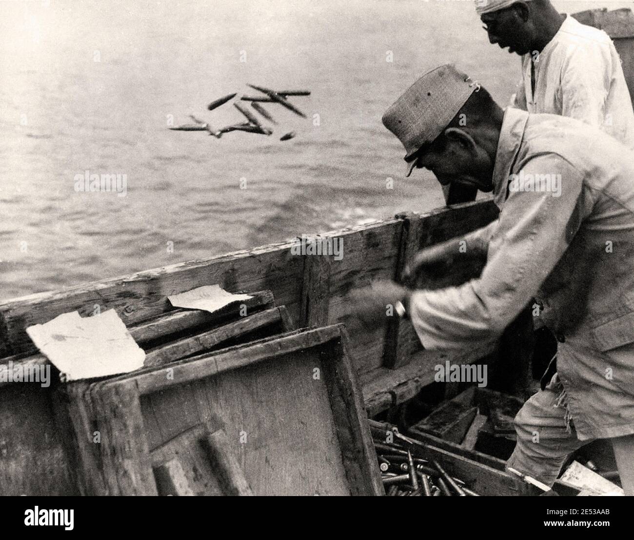 Japanese ammunition being dumped into the sea on September 21, 1945. During the U.S. occupation, almost all of the Japanese war industry and existing Stock Photo