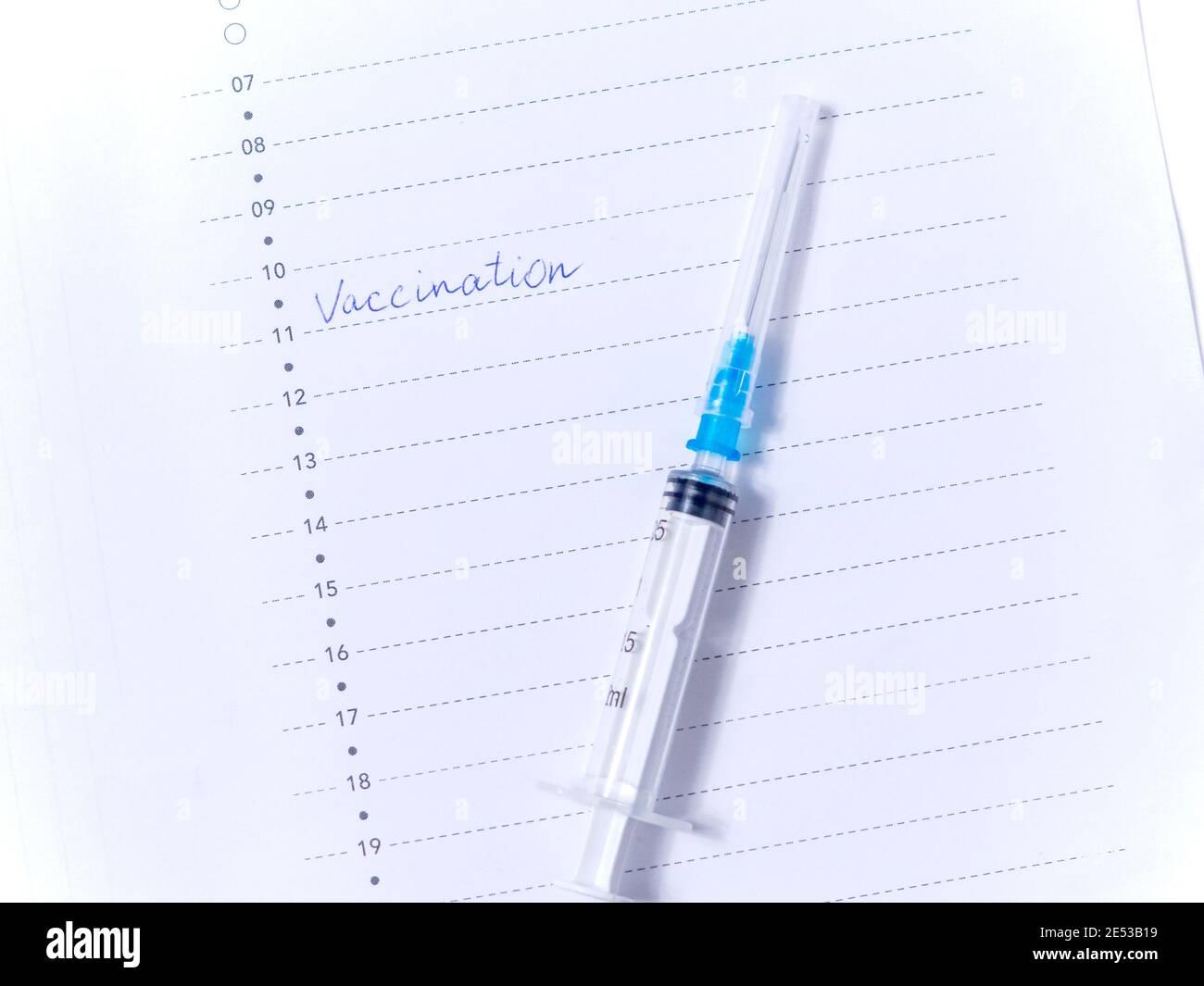 Close up view photo of word vaccination written in daily planner Stock Photo