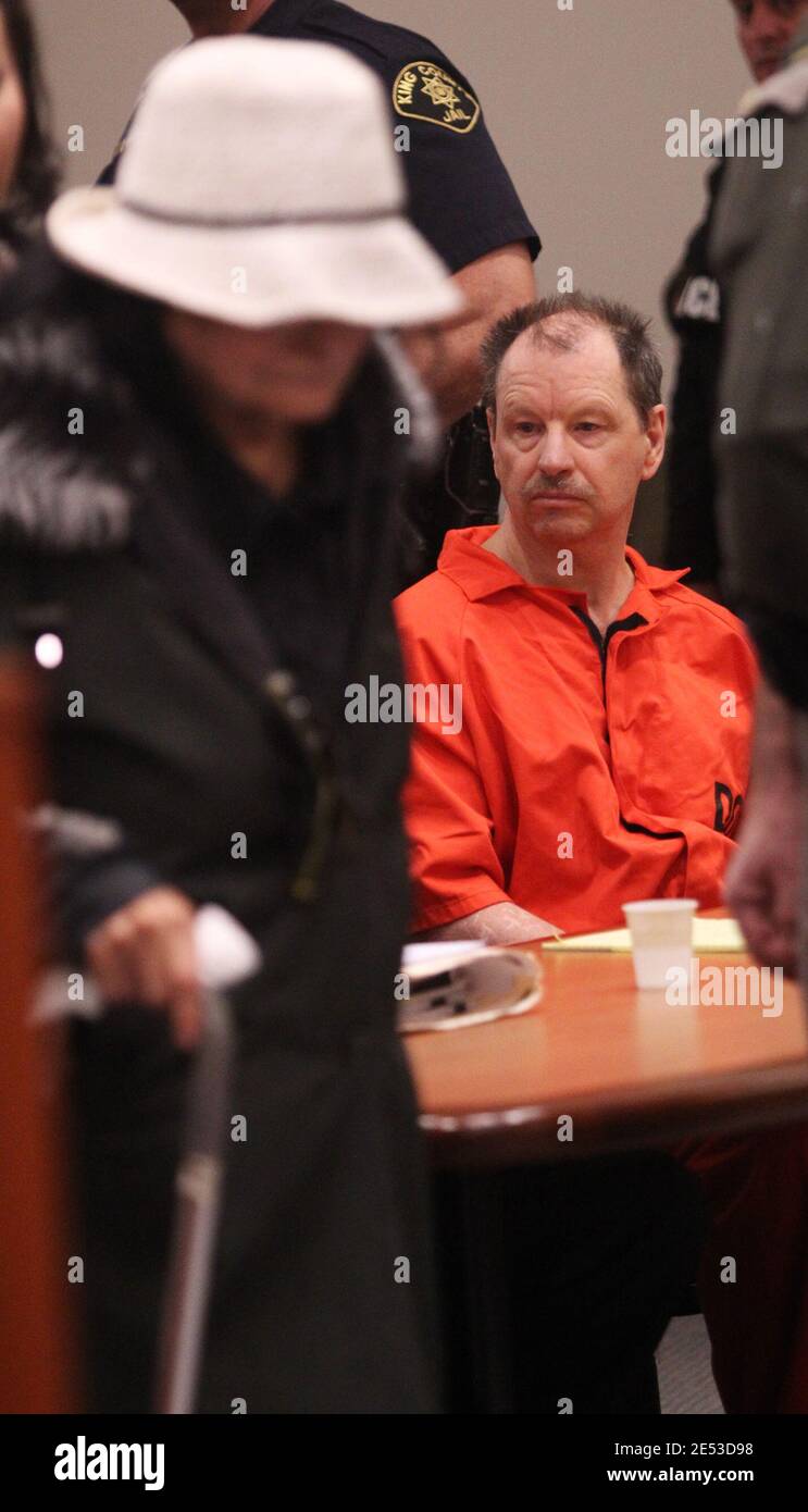 Kent, Washington, USA. 18th Feb, 2011. GARY RIDGWAY, whose 62nd is today, the Green River Killer, looks downward as REBECCA MARRERO, the mother of Ridgway's 49th known victim Rebecca ''Becky'' Marrero walks past him before Ridgway plead guilty to aggravated first-degree murder in her death of Becky during court proceedings at the Maleng Regional Justice Center in Kent. Ridgway was sentenced to an additional life sentence as part of his 2003 plea deal. Ridgway was convicted in 2003 of the murders of 48 other women. Becky last seen on December 3, 1982 and is the 49th confirmed victim of the G Stock Photo