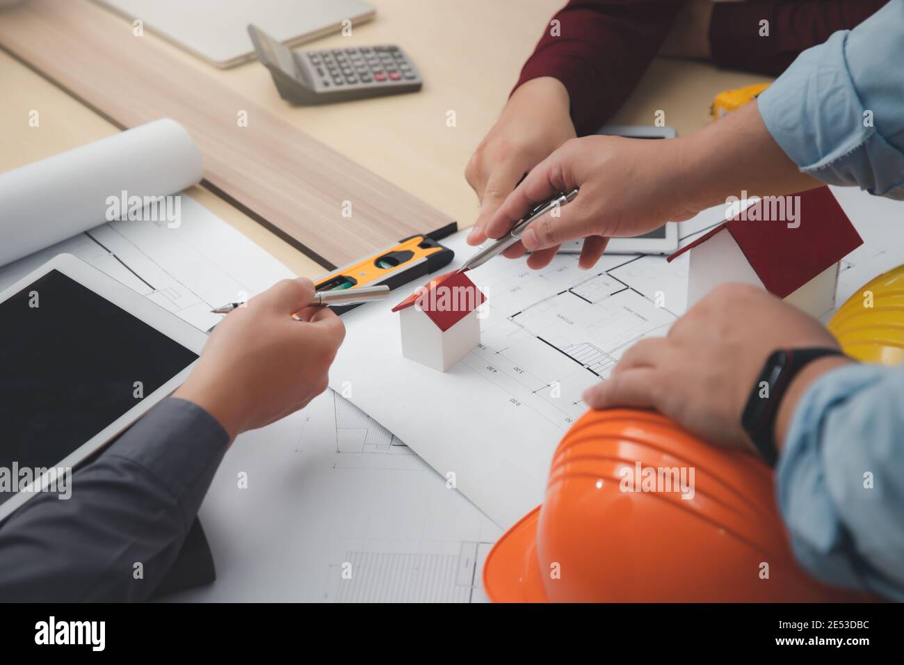 Engineer and Architect concept, Engineer Architects  and Interior designer working with blueprints Stock Photo