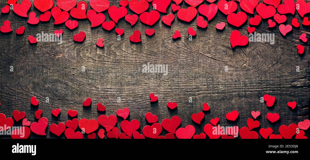 Valentine Card - Red Hearts On Wooden Table Stock Photo