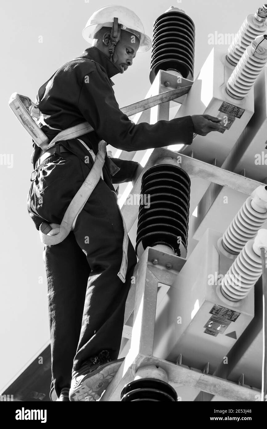 JOHANNESBURG, SOUTH AFRICA - Jan 06, 2021: Johannesburg, South Africa, 04/11/2012, Electricians working on high voltage power lines. Highly skilled wo Stock Photo