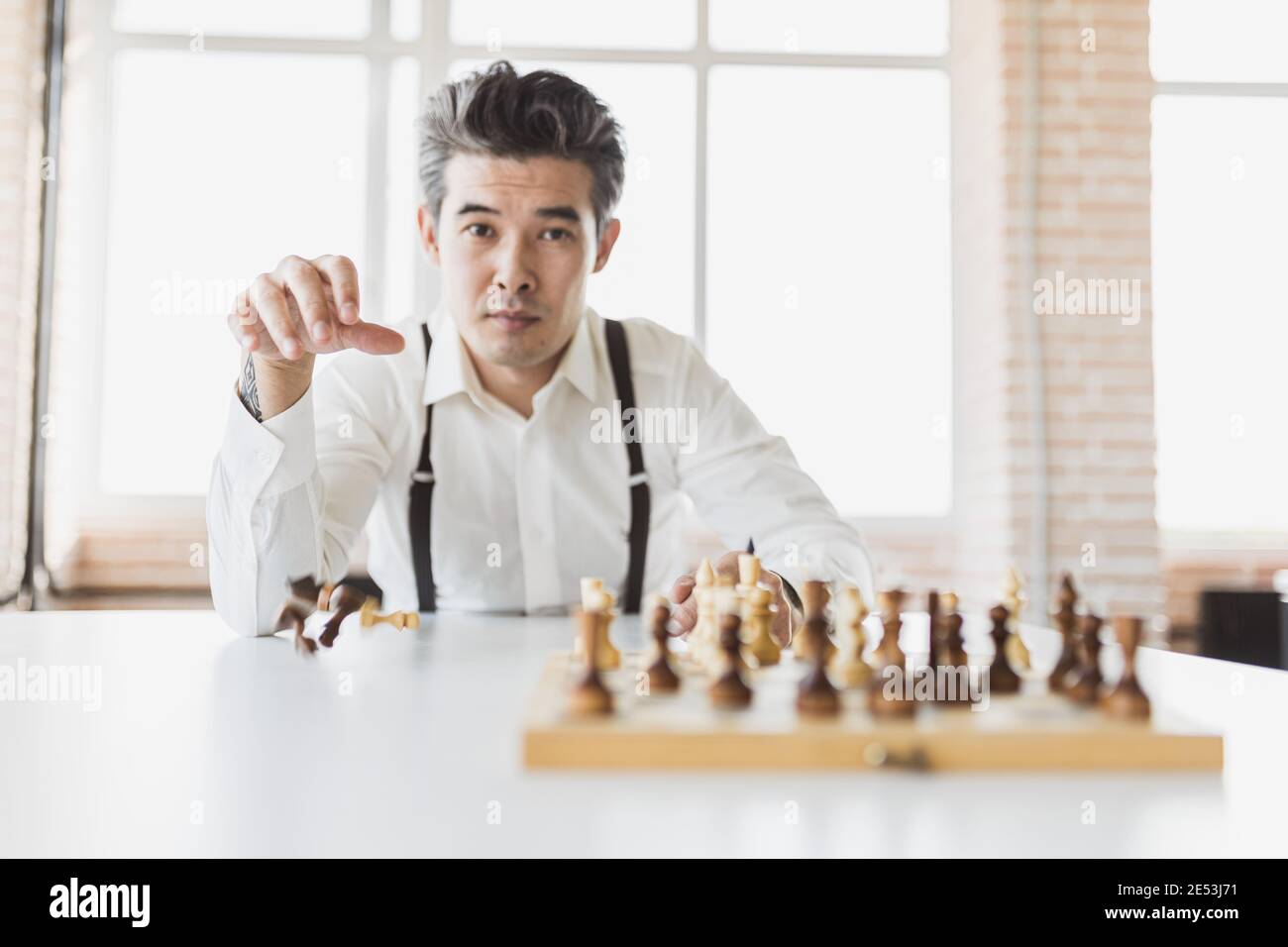 planning strategy with chess figures on an old wooden table