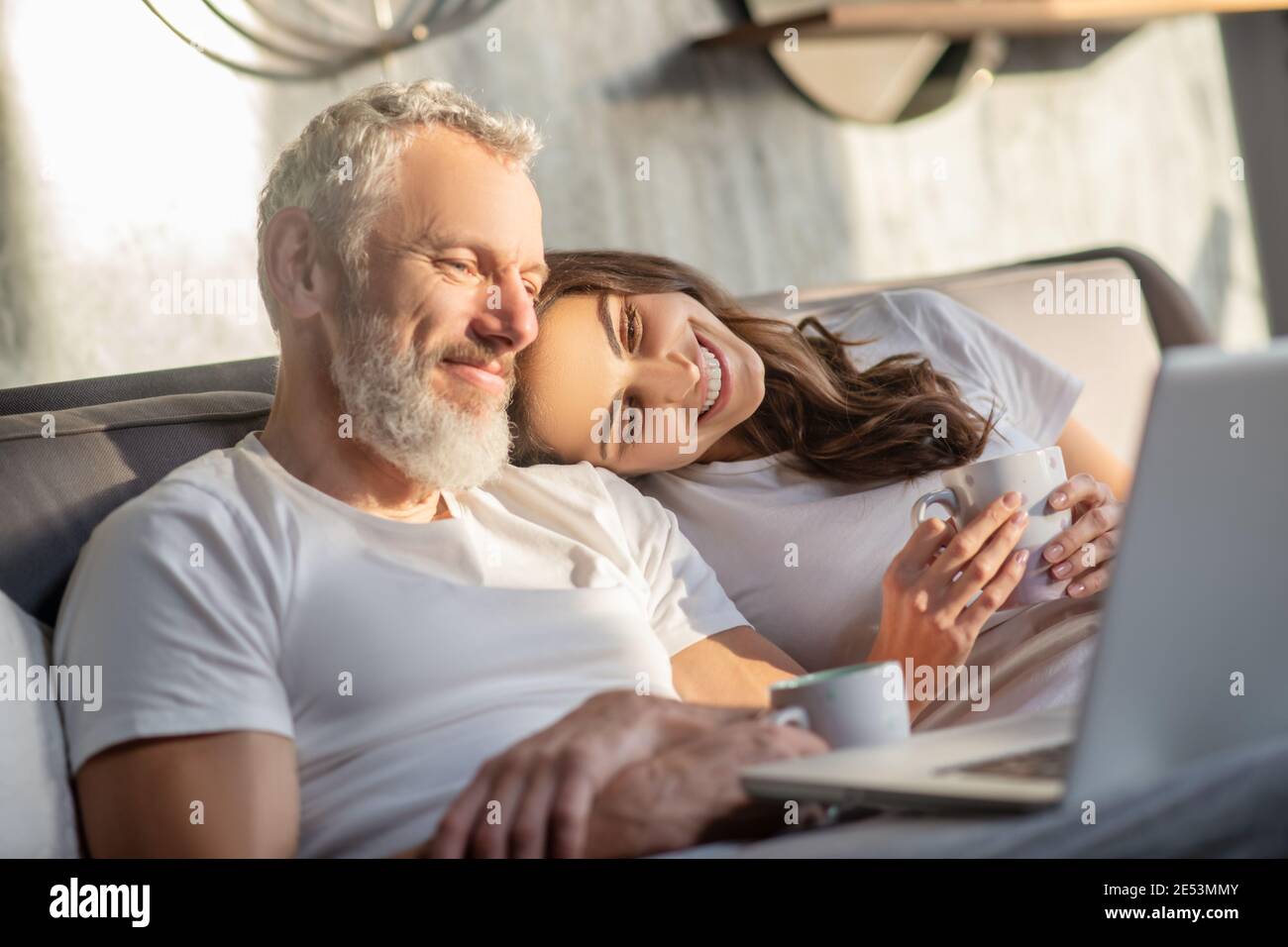 Woman touching her head on mans shoulder Stock Photo